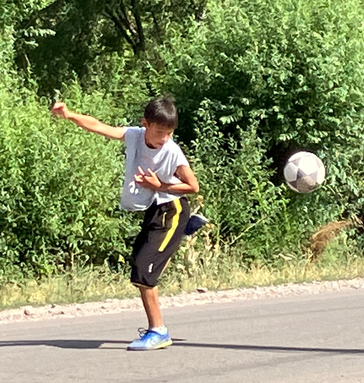 Child playing with soccer ball